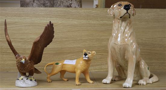 A large Beswick Labrador, no.2314, a lioness and an eagle, no.2062 tallest 34cm